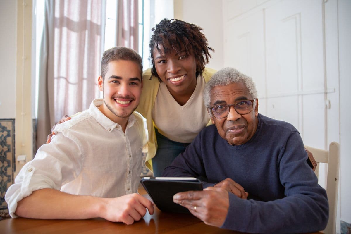 A family reviewing care information together with an older relative